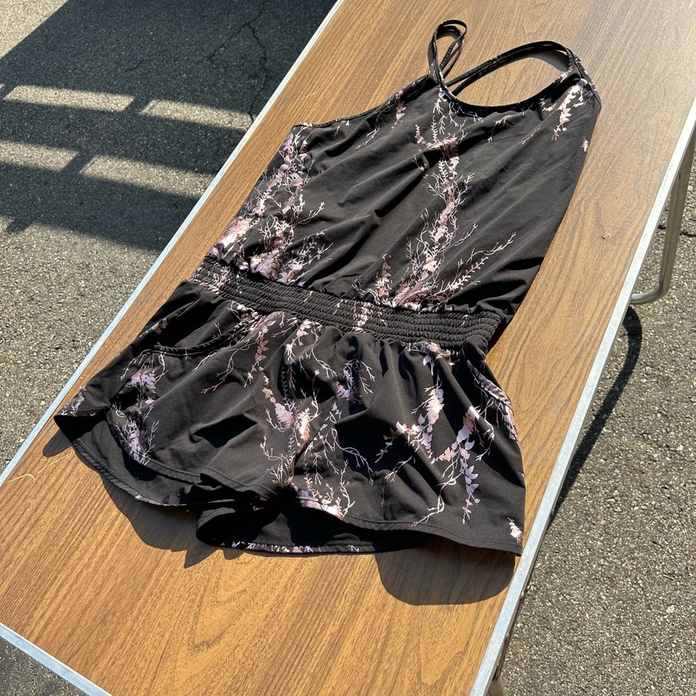 Sweaty Betty black with pink foil print shorts romper